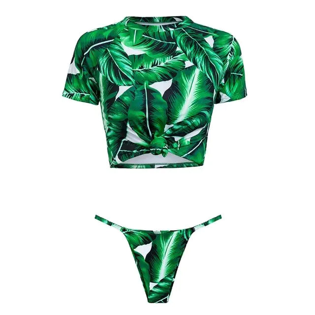 Green leaf-patterned bikini set on a white background