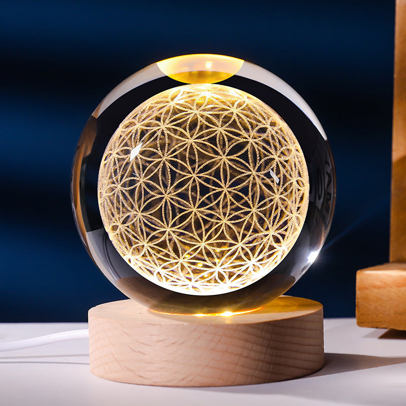 Crystal ball with geometric design on a wooden base against a dark blue background