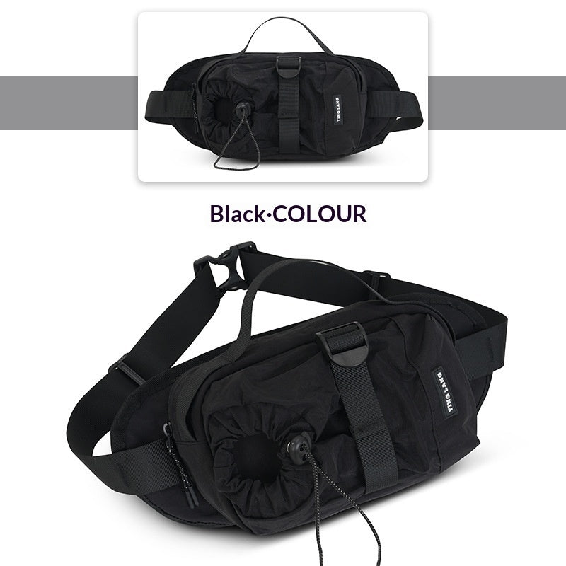 Black waist bag with a strap on a white background