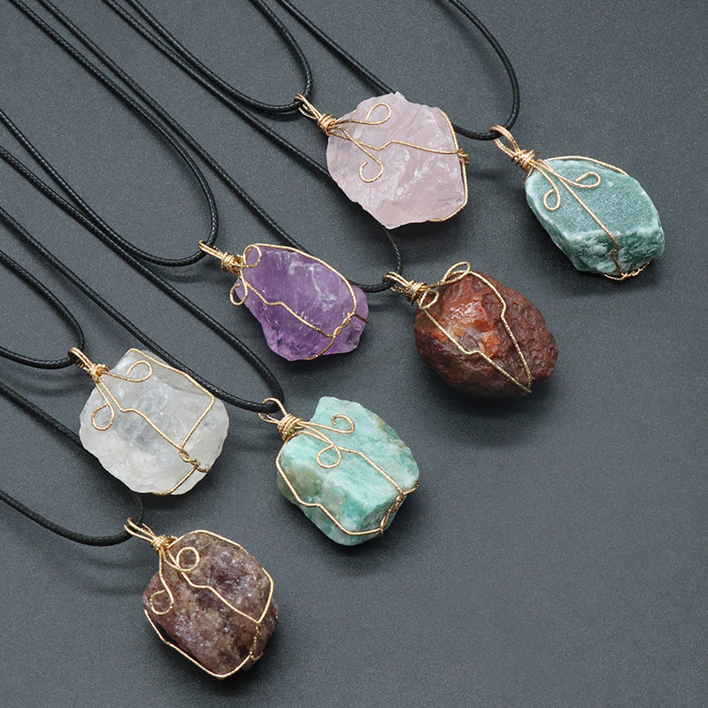 Necklaces with stone pendants on a dark gray background