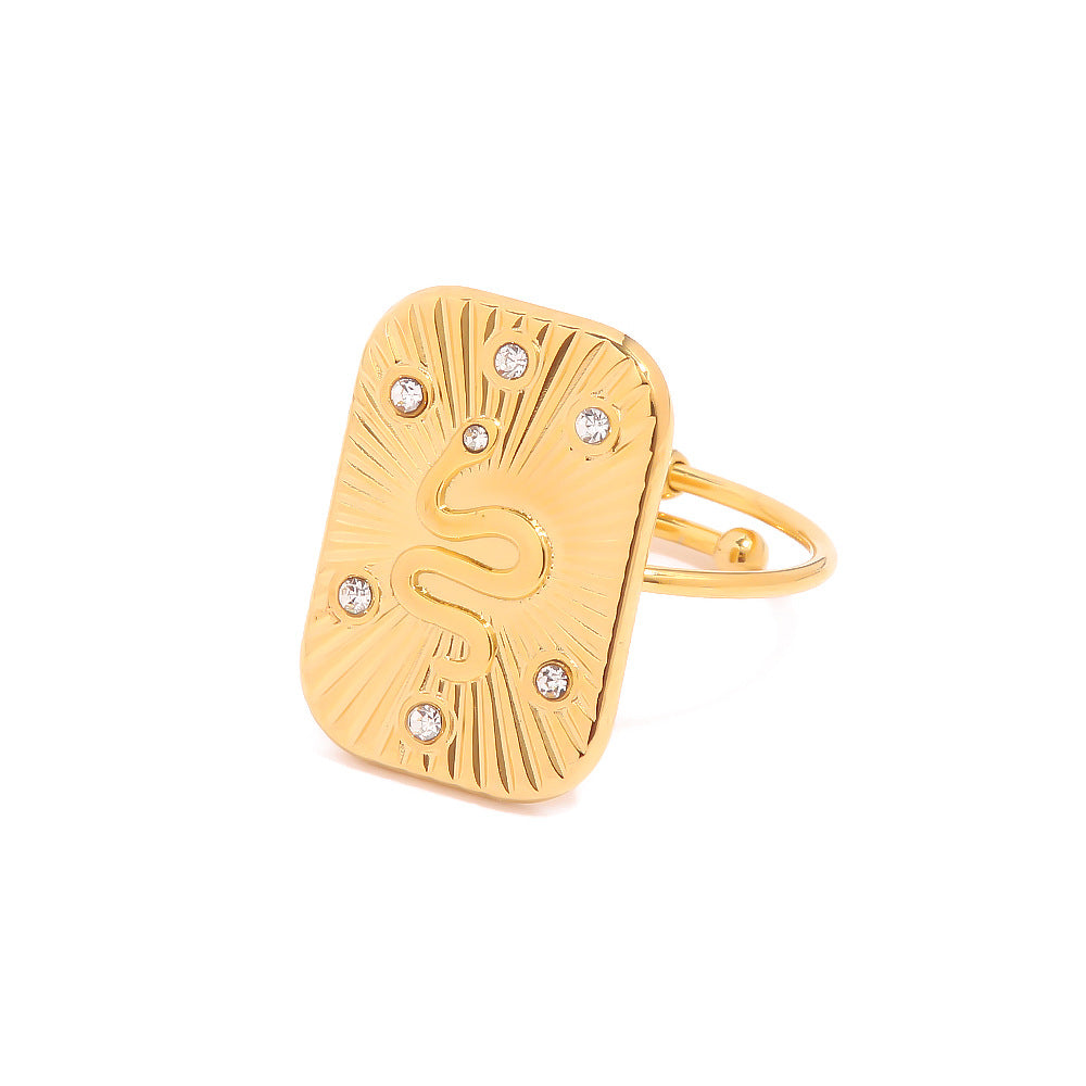 Gold ring with diamond accents on a white background