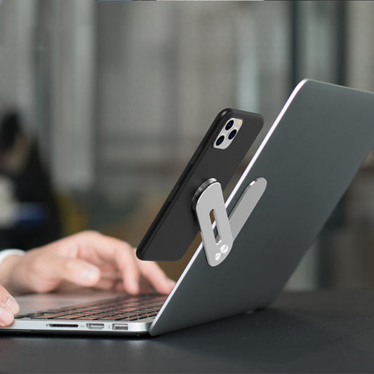 Phone case with stand on a laptop