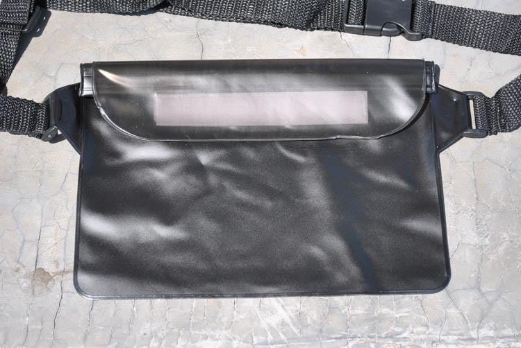 Black waist bag with a clear window on a textured surface