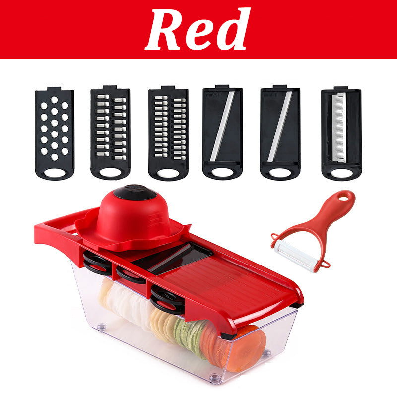 Red mandoline slicer with multiple attachments on a white background