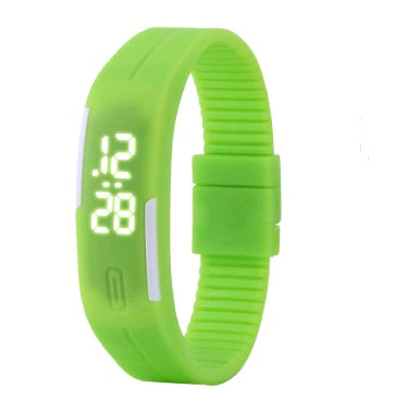 Green digital wristband with LED display on a white background