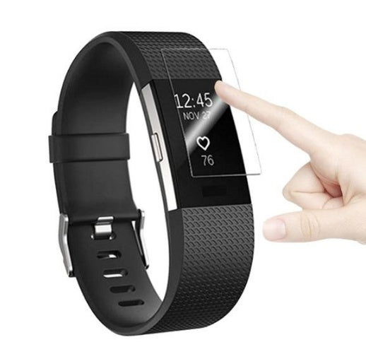 Black fitness tracker with a hand touching the screen on a white background
