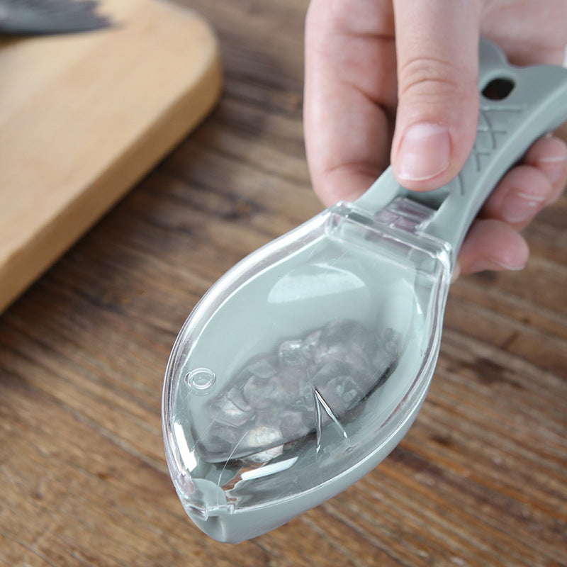 Clear plastic scoop with small stones on a wooden surface