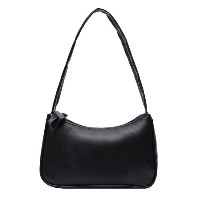 Black handbag with a bow detail on a white background