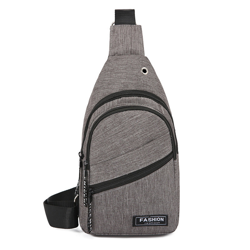 Gray sling bag with black accents on a white background