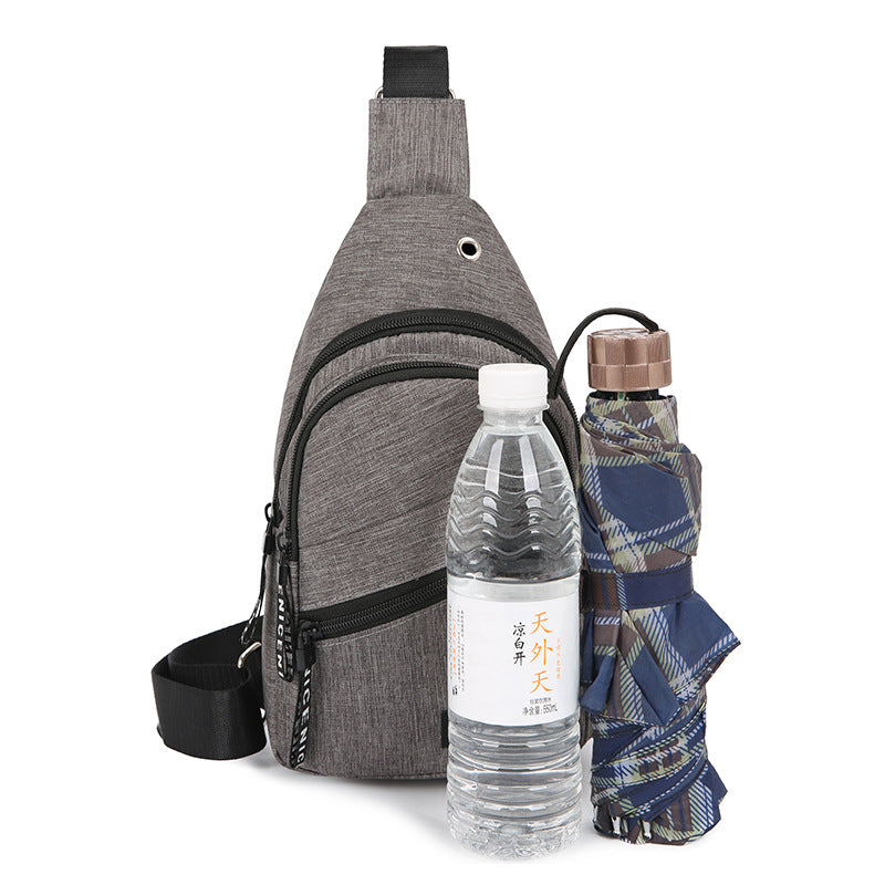 Gray sling bag with a water bottle and plaid umbrella on a white background
