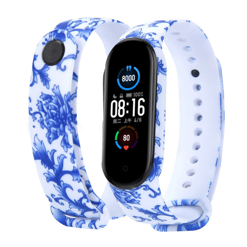 Smartwatch with a blue and white floral patterned band on a white background