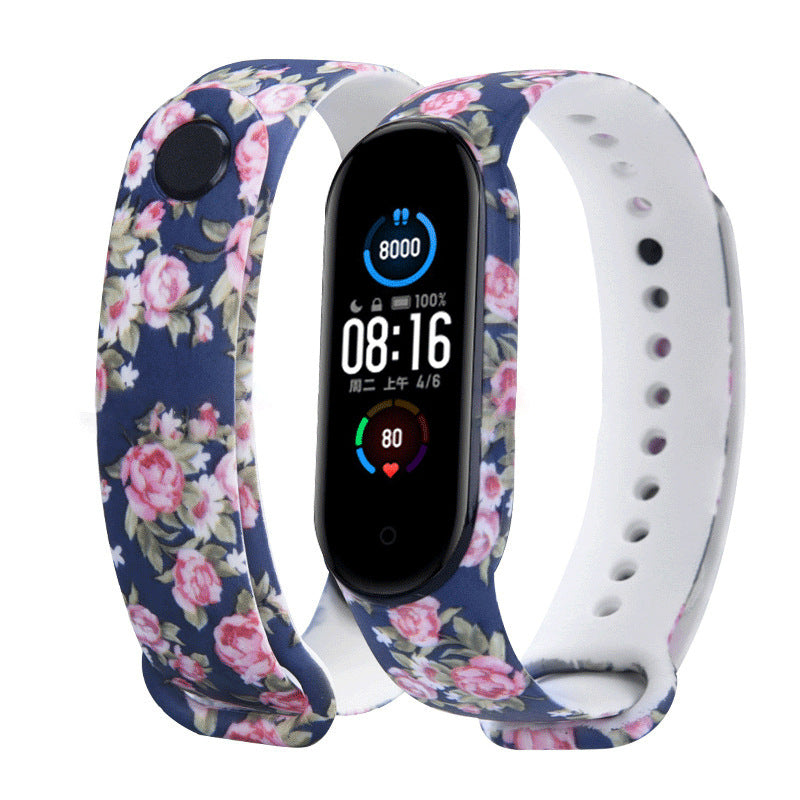 Smartwatch with floral and white band on a white background
