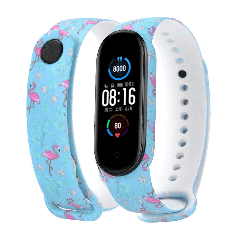 Smartwatch with a blue strap featuring flamingo designs on a white background