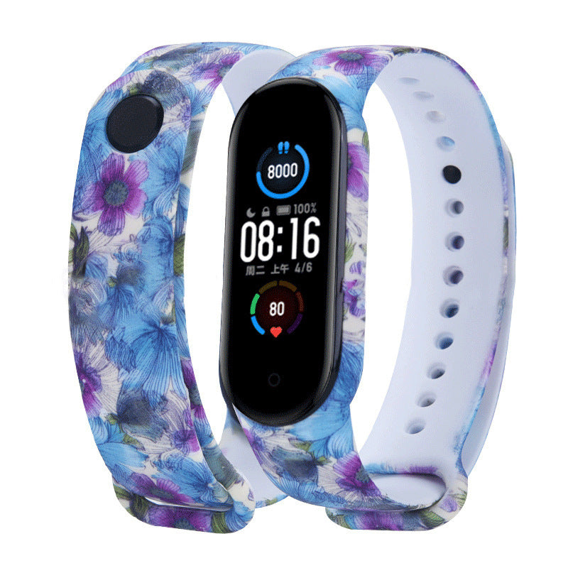 Smartwatch with a floral patterned band on a white background