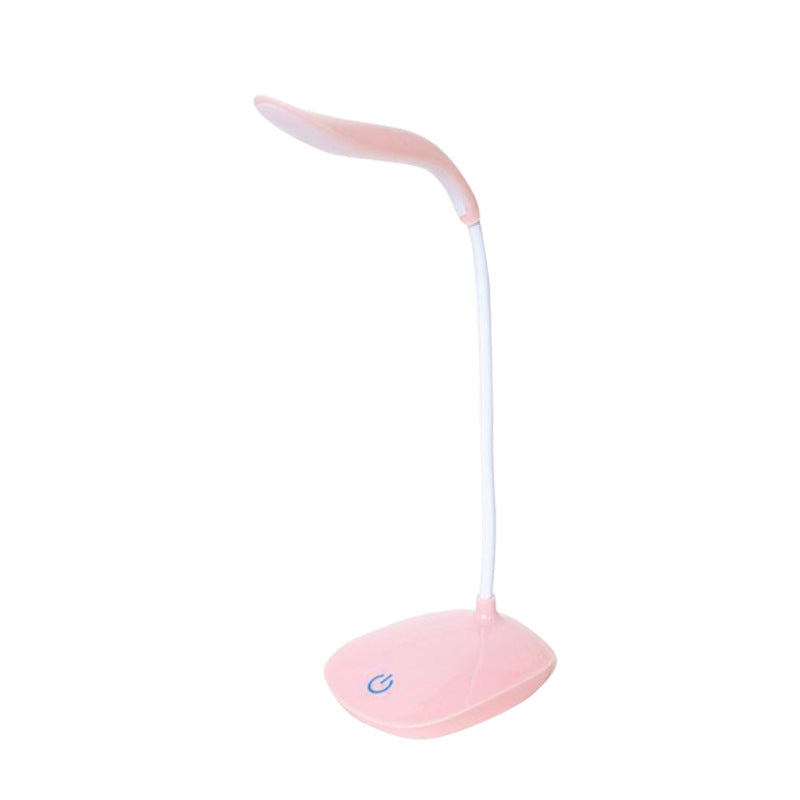 Pink LED desk lamp on a white background