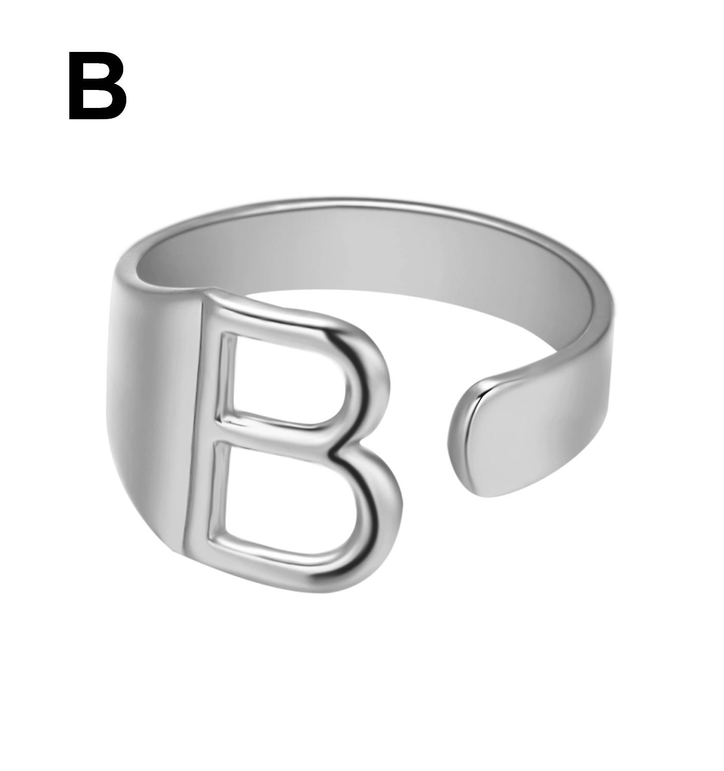 Silver ring with letter 'B' on a white background