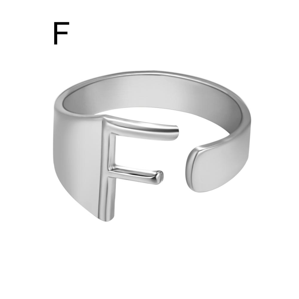 Silver open ring with letter 'F' on a white background