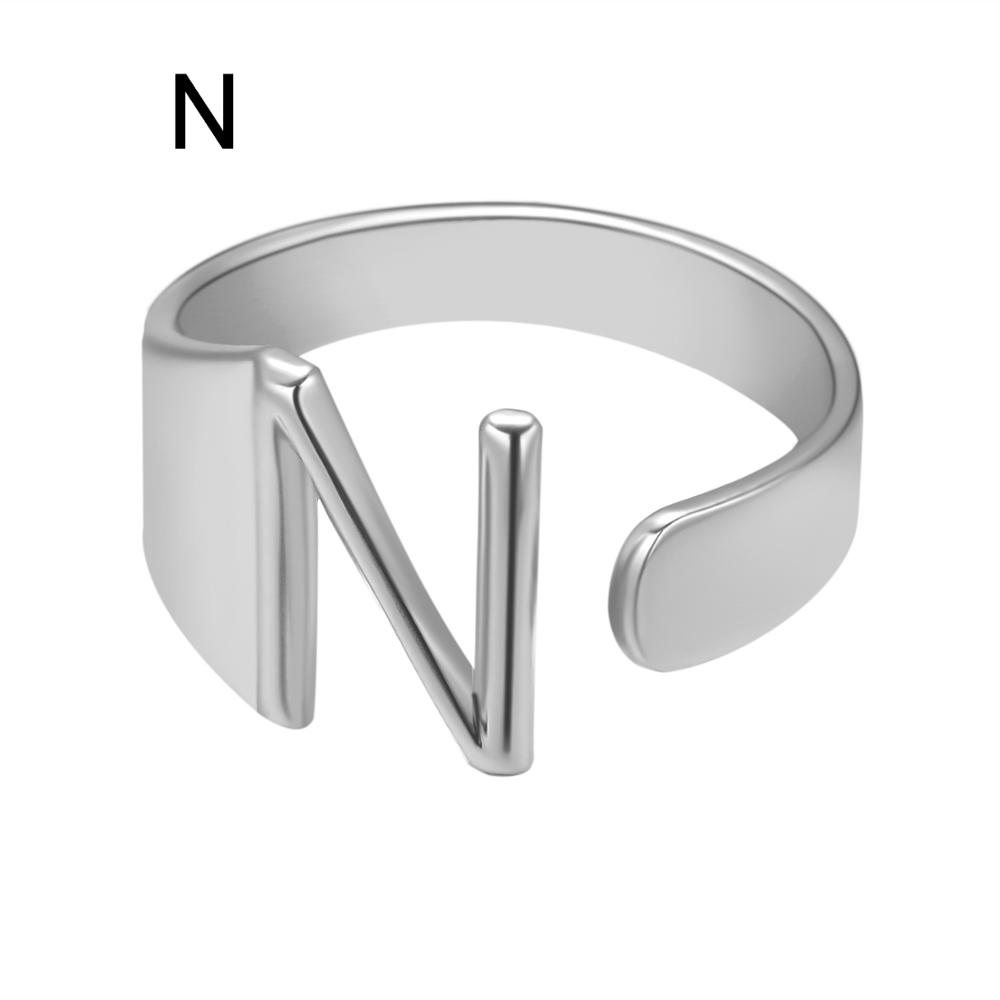 Silver ring with a unique design on a white background