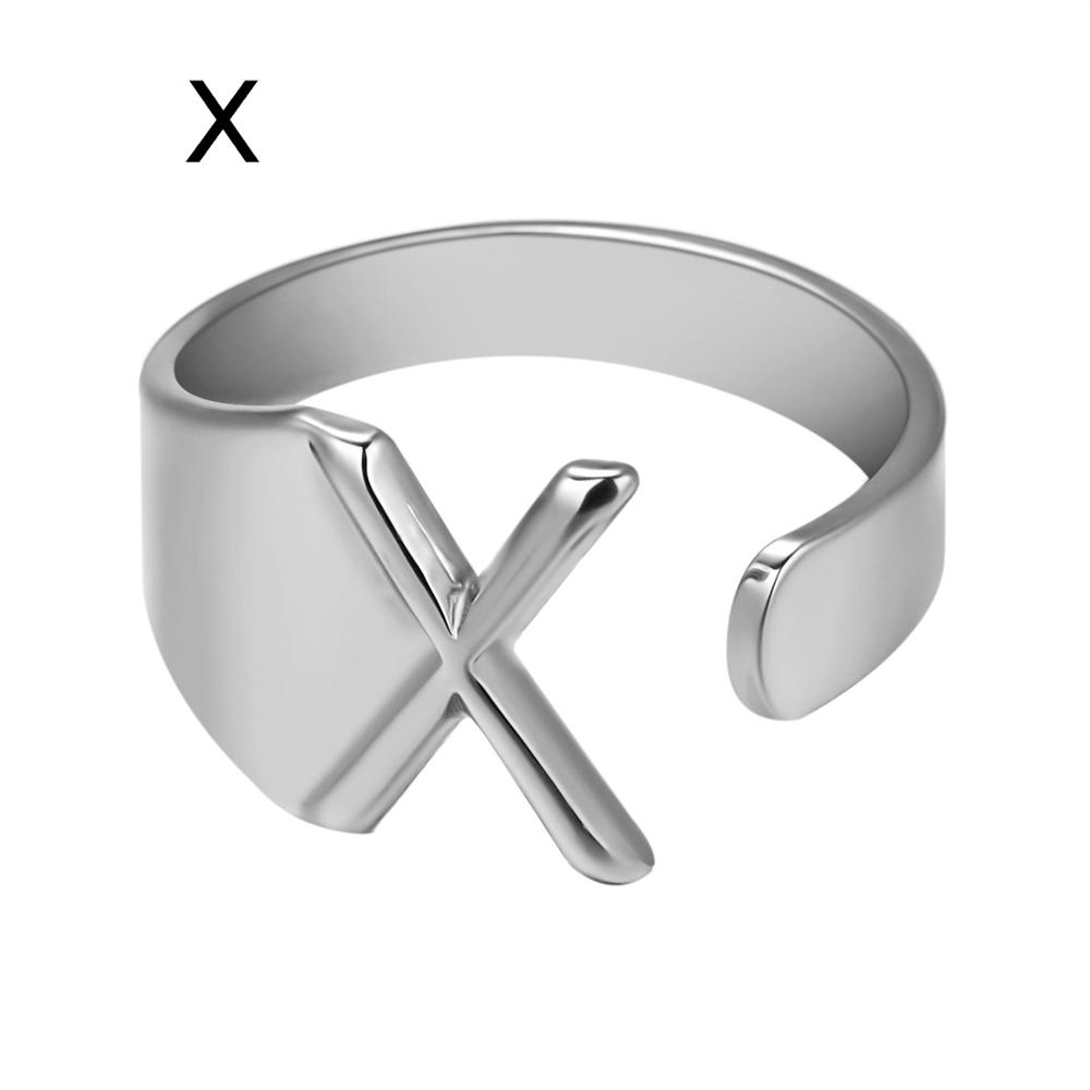 Silver ring with a 'X' design on a white background