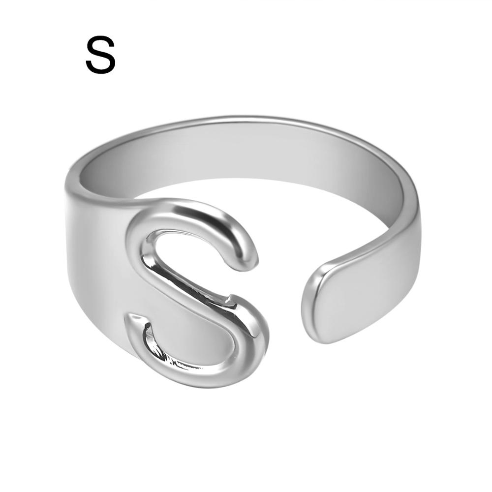 Silver ring with letter 'S' on a white background