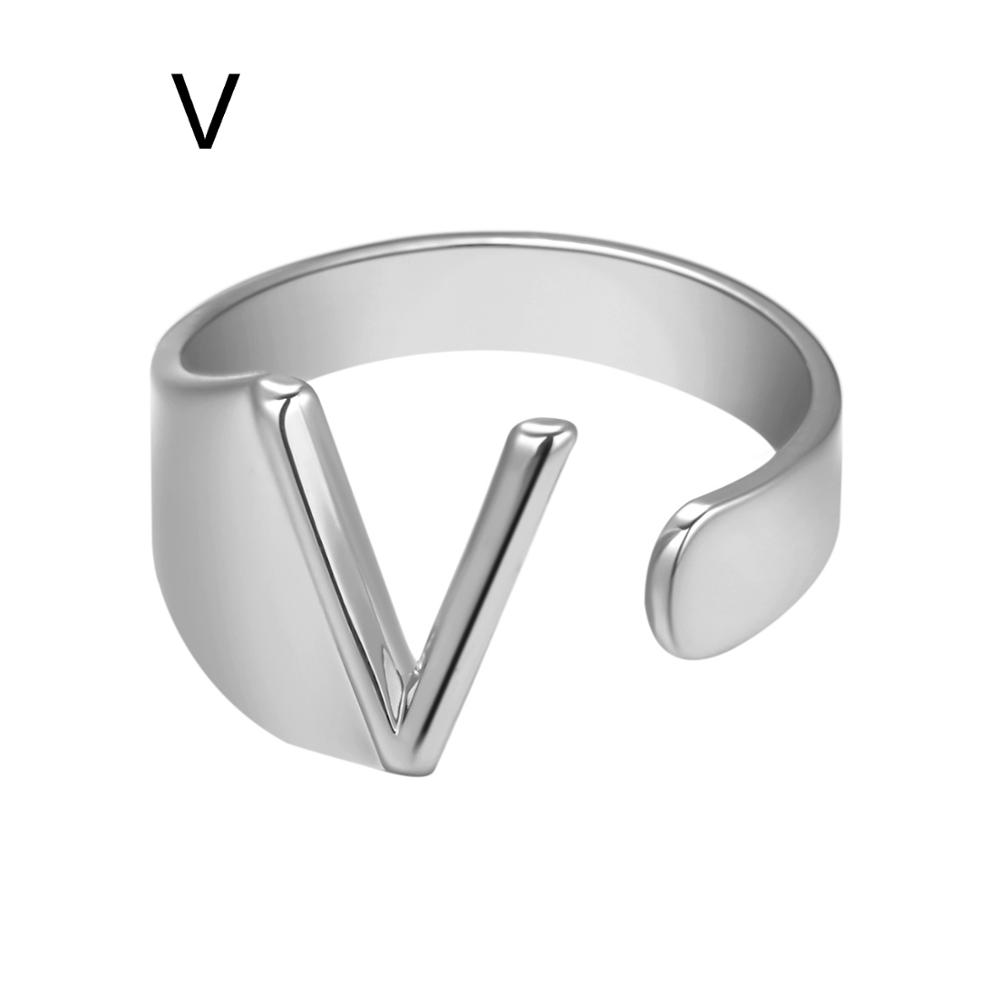 Silver V-shaped ring on a white background