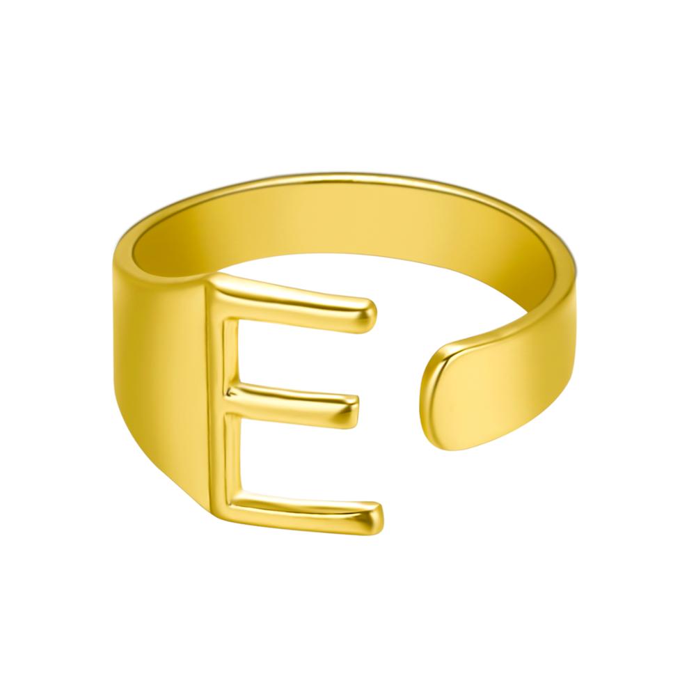 Gold ring with the letter 'E' on a white background