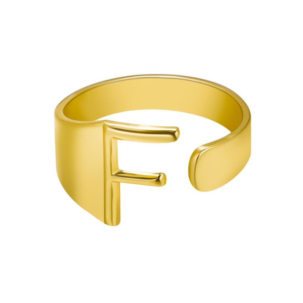 Gold ring with letter 'F' on a white background