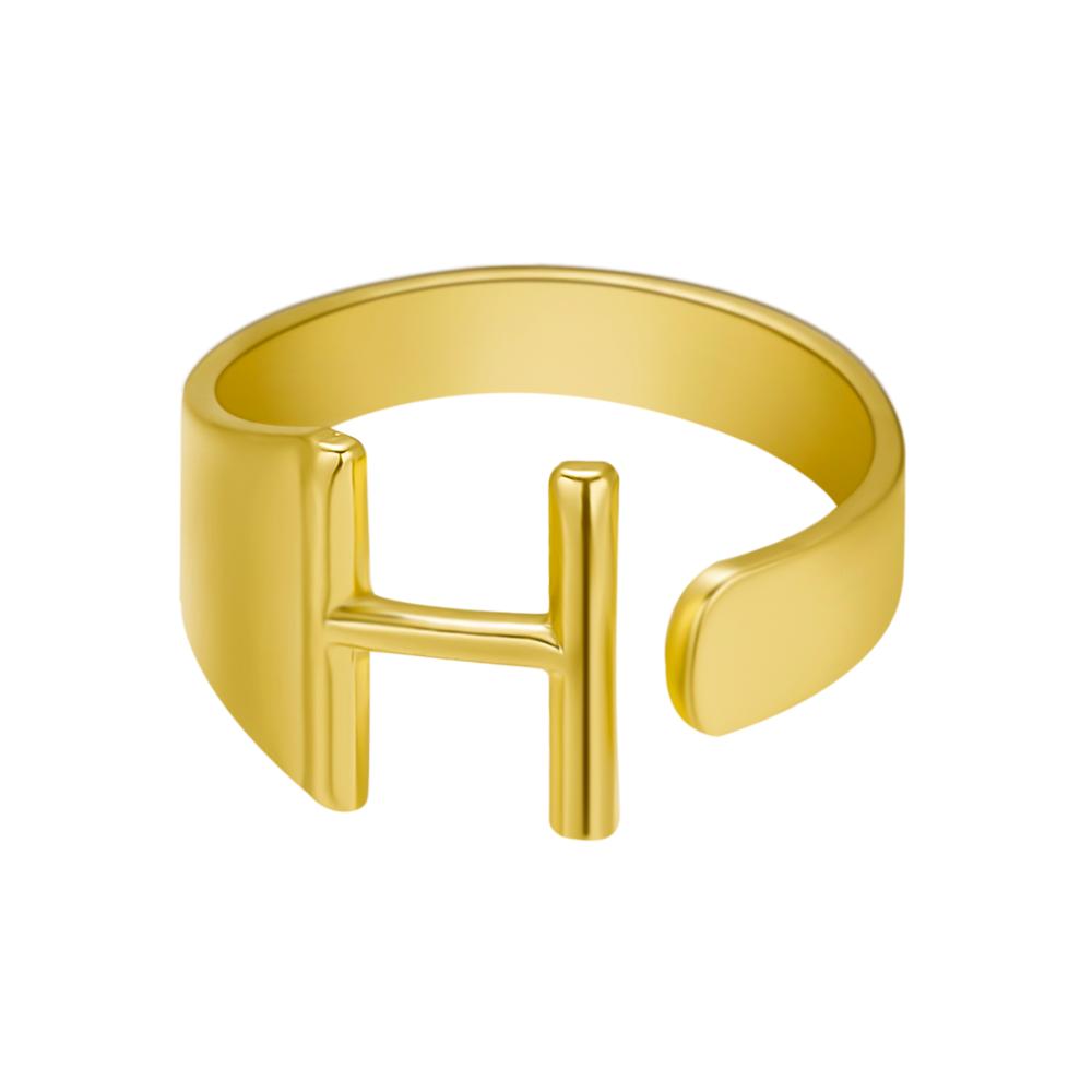 Gold ring with the letter 'H' on a white background