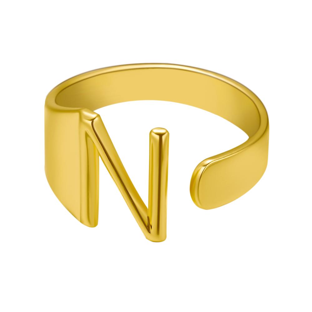 Gold ring with letter 'N' on a white background