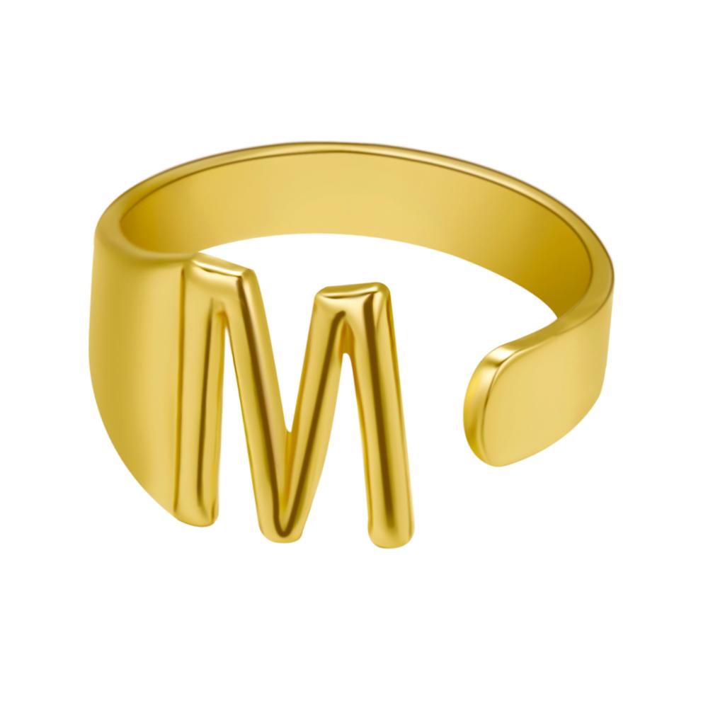 Gold ring with letter 'M' on a white background