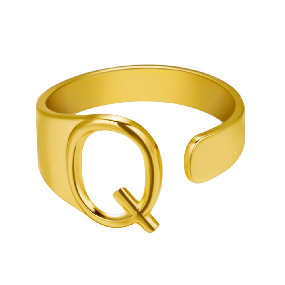 Gold letter 'Q' ring on a white background