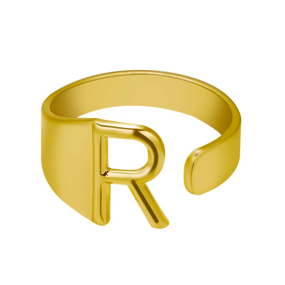 Gold ring with letter 'R' on a white background