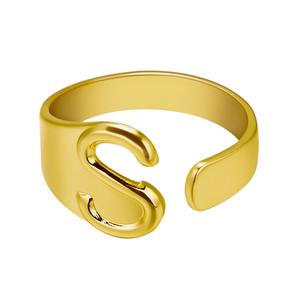 Gold ring with letter 'S' on a white background
