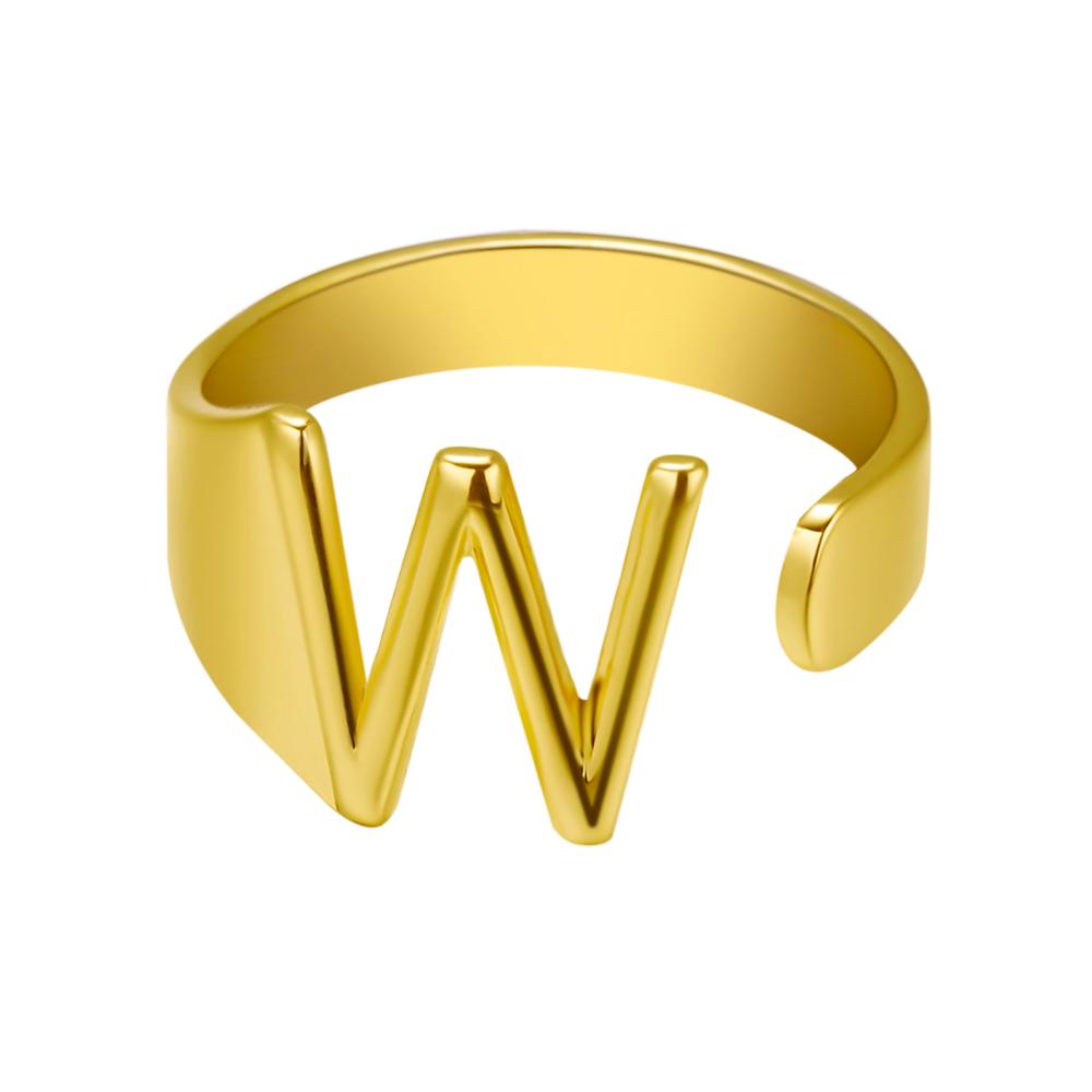 Gold ring with the letter 'W' on a white background