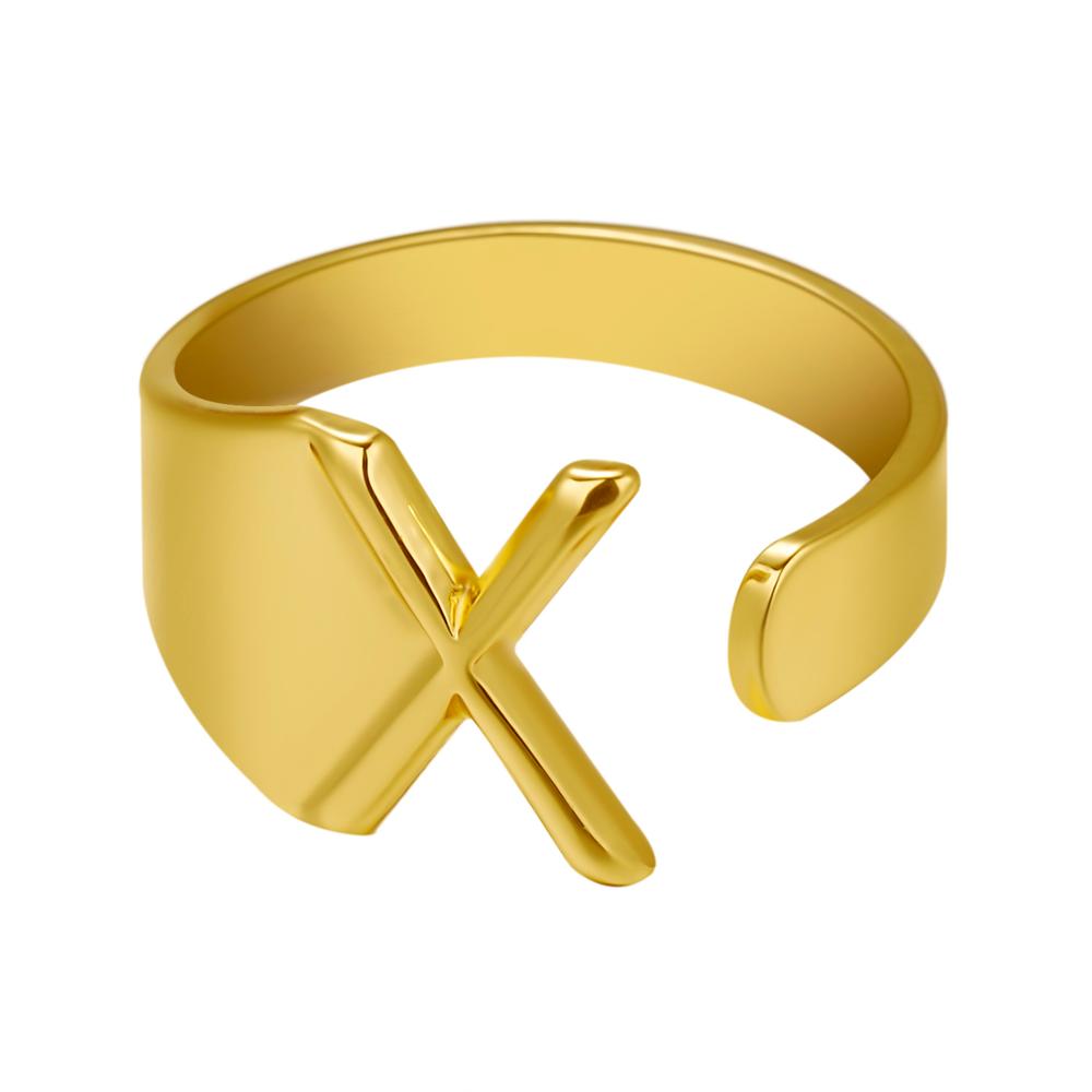 Gold ring with a unique design on a white background