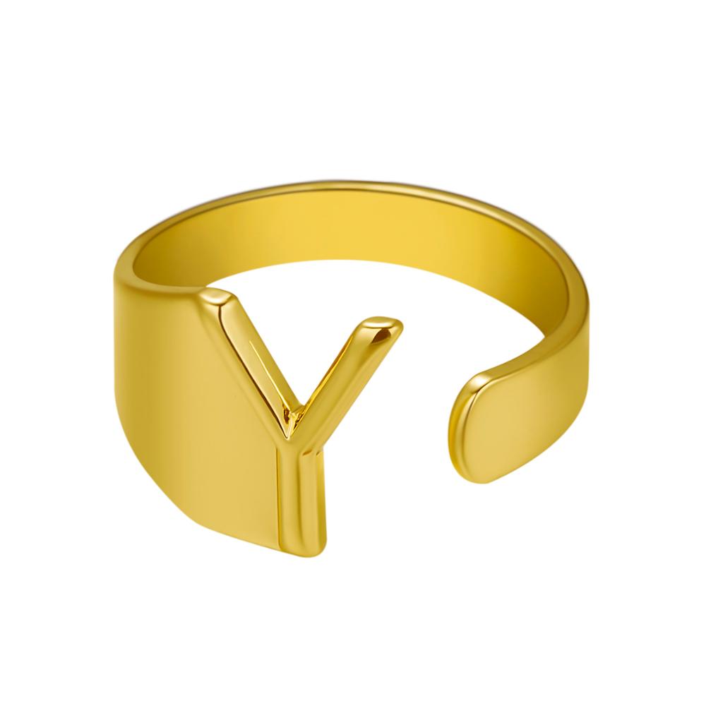 Gold ring with a V-shaped design on a white background