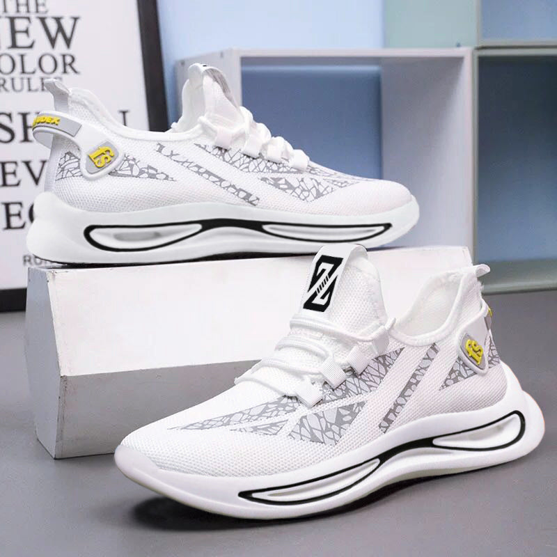 White sneakers with black and gray patterns on a gray surface