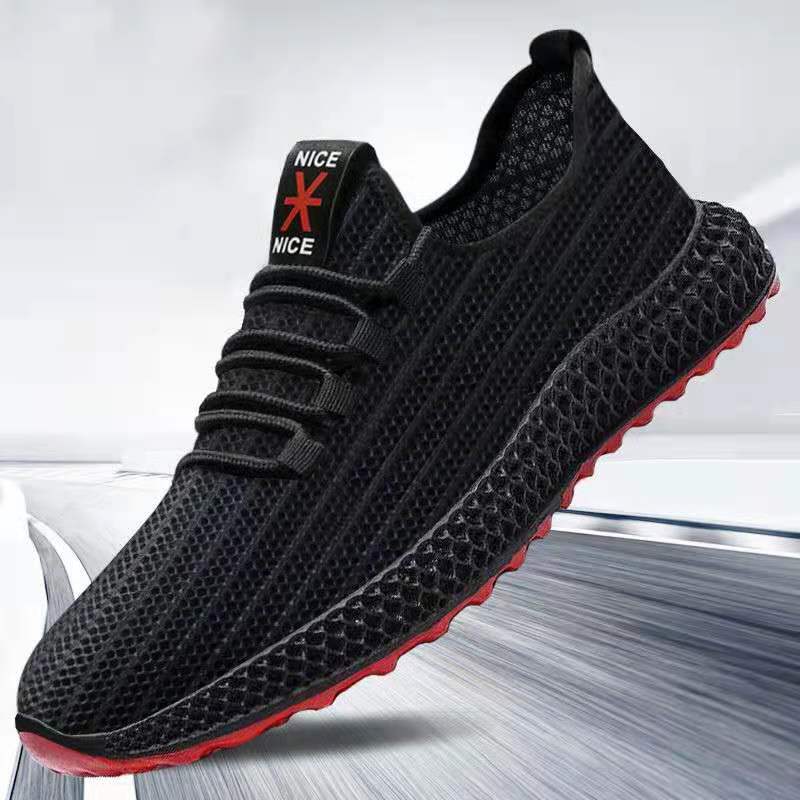 Black sneaker with red sole on a white background