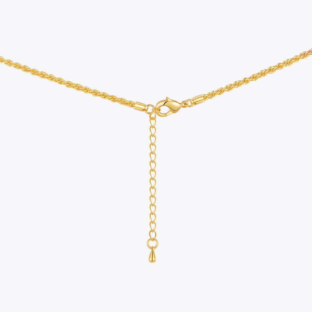 Gold necklace with a clasp on a white background