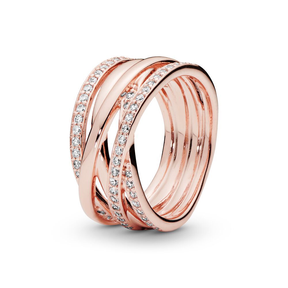 Rose gold ring with embedded diamonds on a white background