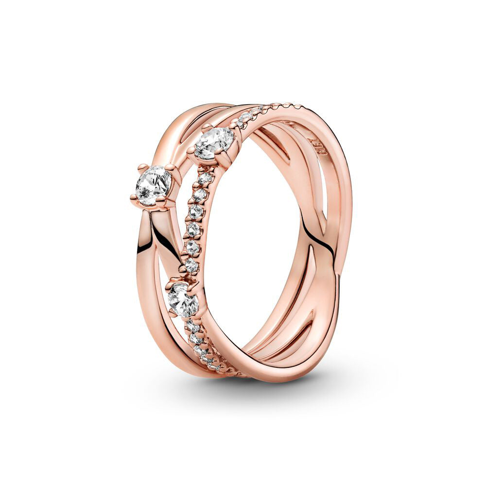 Rose gold ring with embedded diamonds on a white background