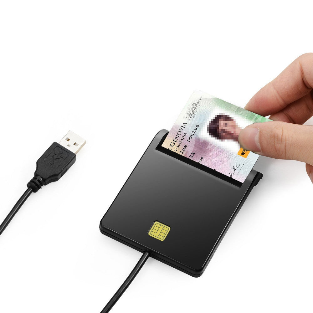 Hand holding a card above a card reader with a USB cable on a white background