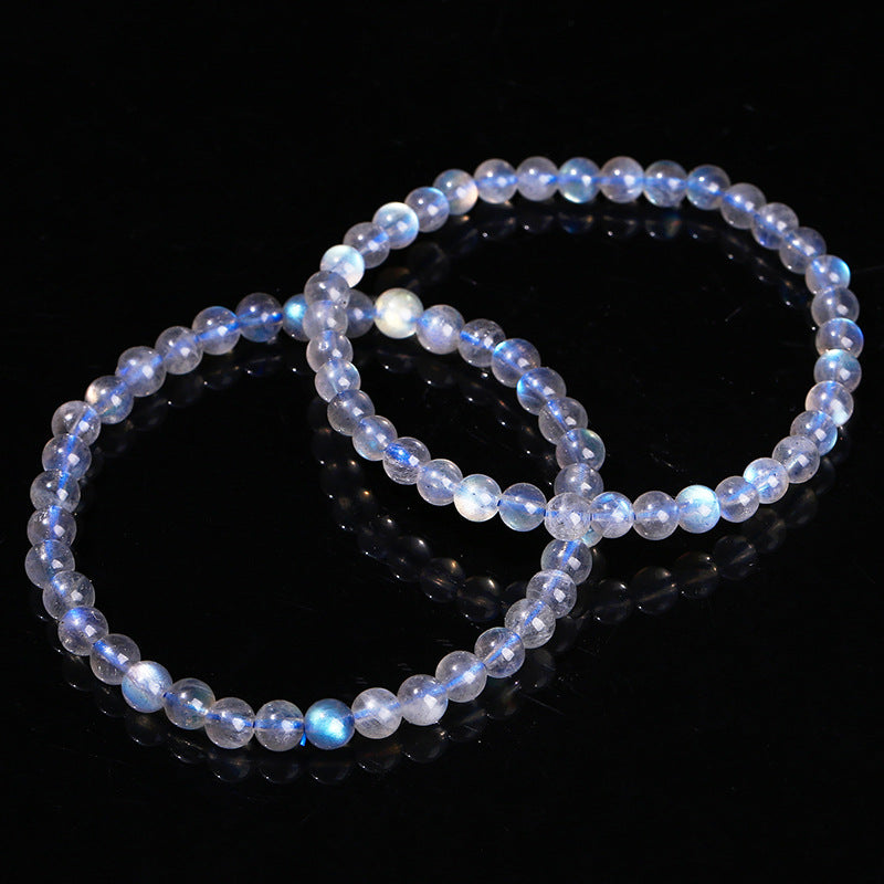Two beaded bracelets on a black background
