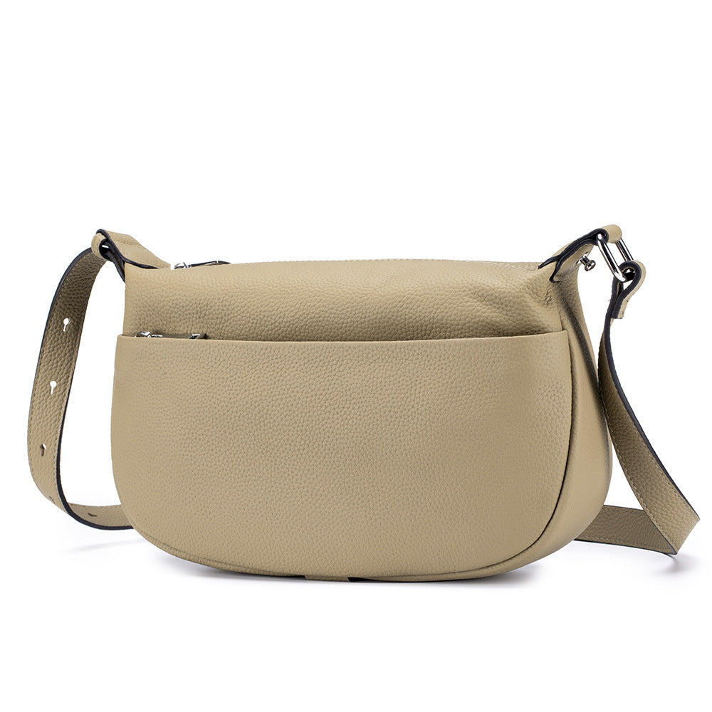 Beige crossbody bag on a white background