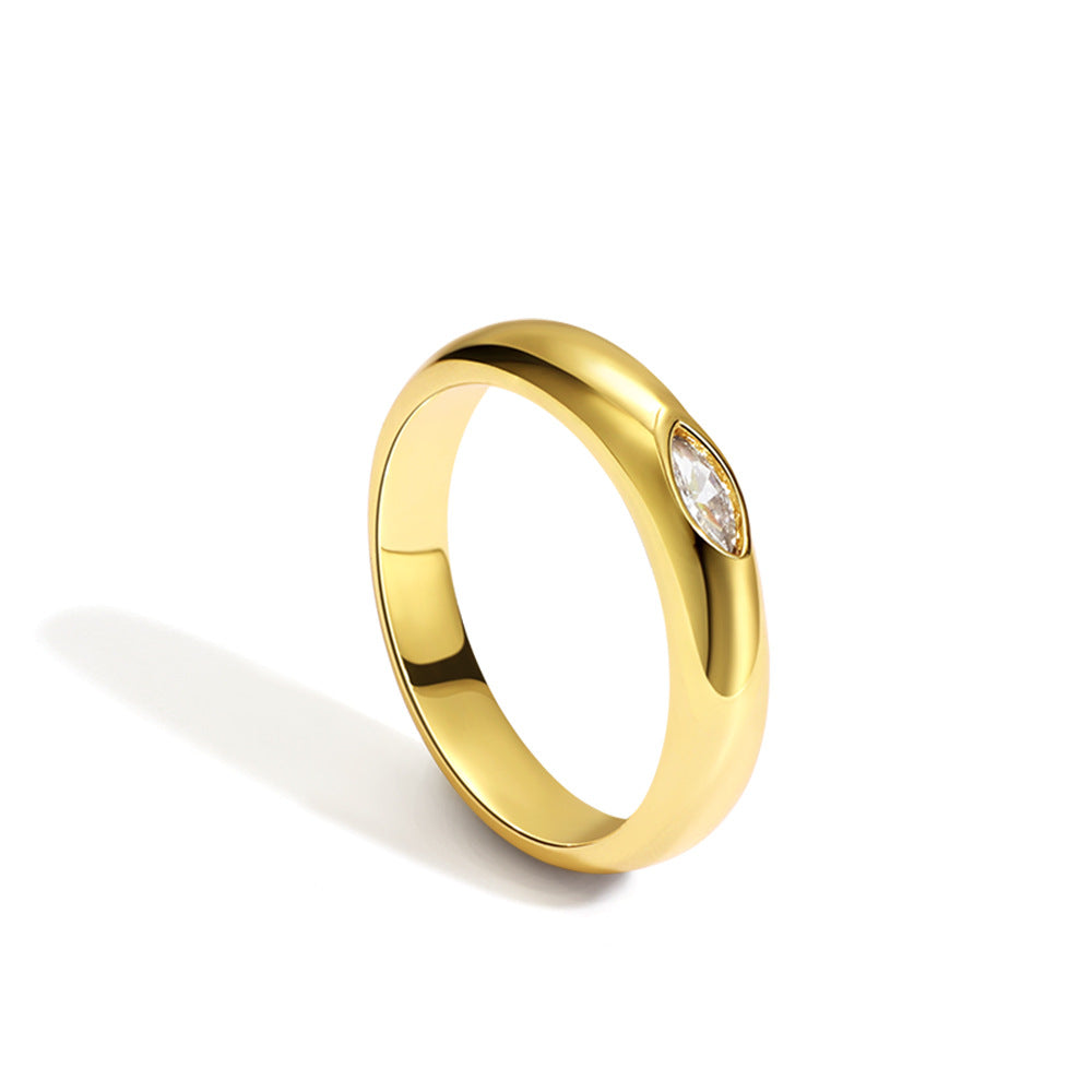 Gold ring with a diamond on a white background