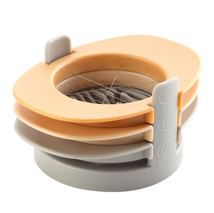 Stackable kitchen tool with orange top and gray base on a white background