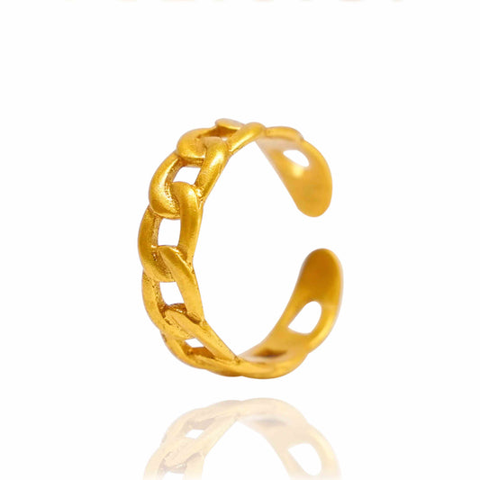 Gold chain-style ring on a white background
