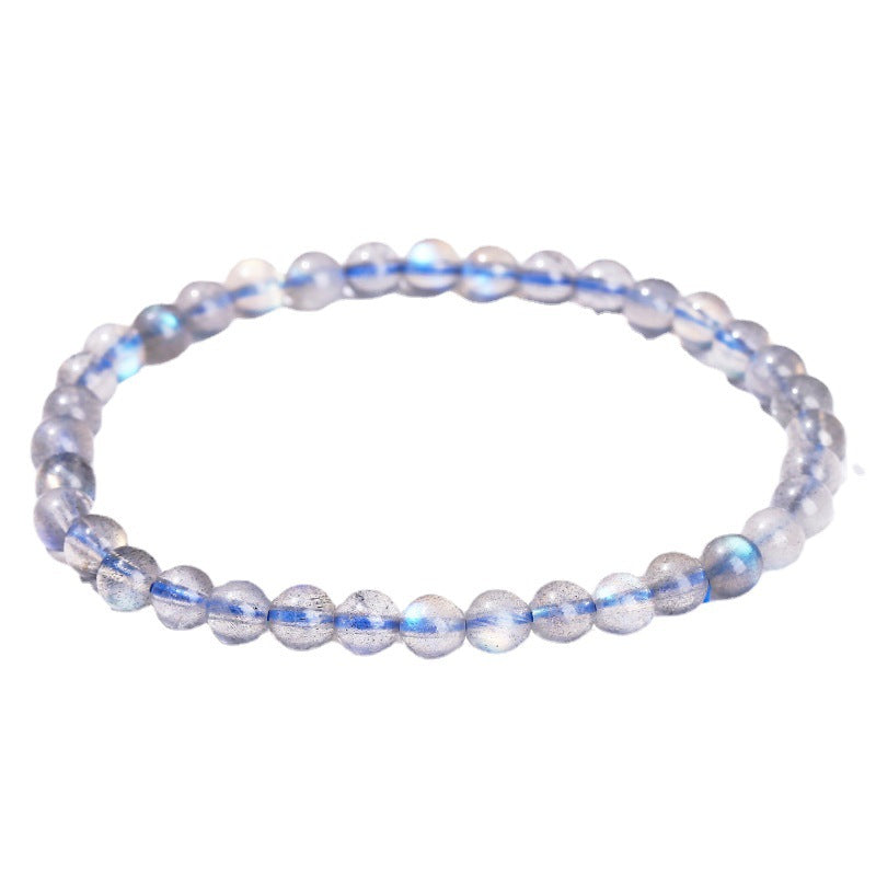 Beaded bracelet with blue and clear beads on a white background