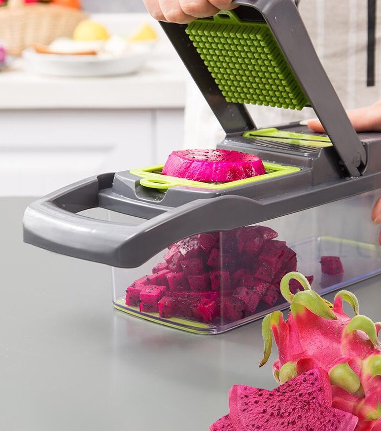 Dragon fruit being sliced with a multi-blade slicer on a kitchen counter.
