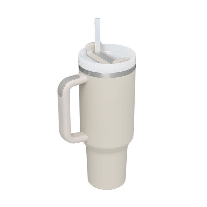 Beige insulated tumbler with handle and straw lid on a white background